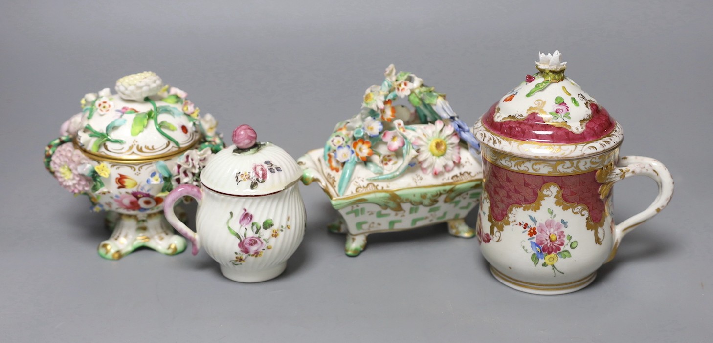 An 18th century Mennecy porcelain cup and cover, a Meissen style cup and cover, an English porcelain floral encrusted double inkwell and cover and a similar jar and cover